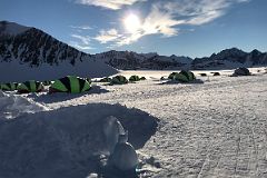 04B The 24 Hour Sun Shines On The Tents Of Union Glacier Camp Antarctica At One Thirty In The Morning With Emperor Penguin Ice Sculpture.jpg